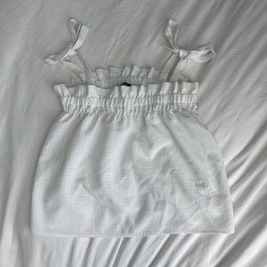 white top with bow sleeves